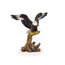 Eagle chauve de poly sur la branche 25 cm