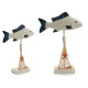 wooden fish figure with large round stand